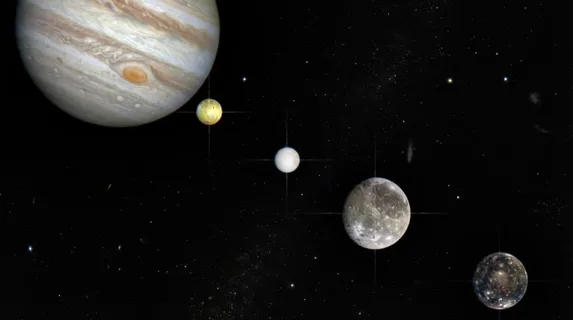 Galilean moons of Jupiter in orbital configuration, Io's sulfur-yellow, Europa's icy white, Ganymede's grey cratered bulk, and Callisto's dark ancient surface visible as distinct world