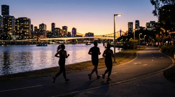Silhouettes of runners jogging through the city at evening, fading light, smooth motion and peaceful urban fitness mood, ultra-realistic, no logos.