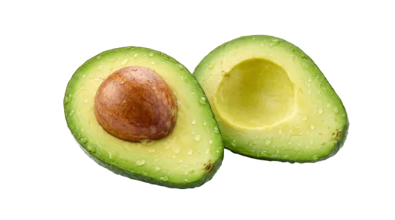A vibrant green avocado is sliced in half, revealing its large brown seed and moist flesh, perfect for healthy eating concepts