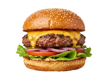 A delicious and appetizing cheeseburger is presented with all its fresh ingredients stacked high on a toasted sesame bun, ready to be enjoyed