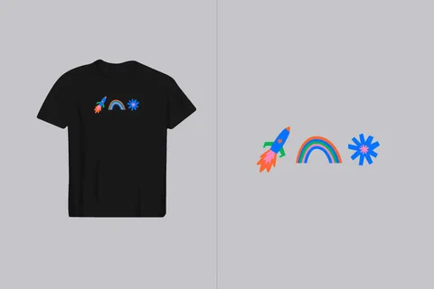 A black t-shirt displays a playful graphic featuring a rocket, a rainbow, and a star in vibrant colors, perfect for kids' apparel