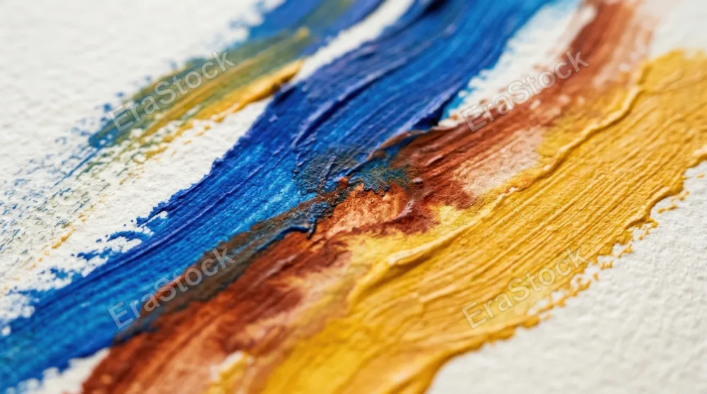 Close-up of painterly color lines flowing diagonally across textured paper surface, thick brushstrokes in contrasting shades of golden yellow, burnt sienna, and cobalt