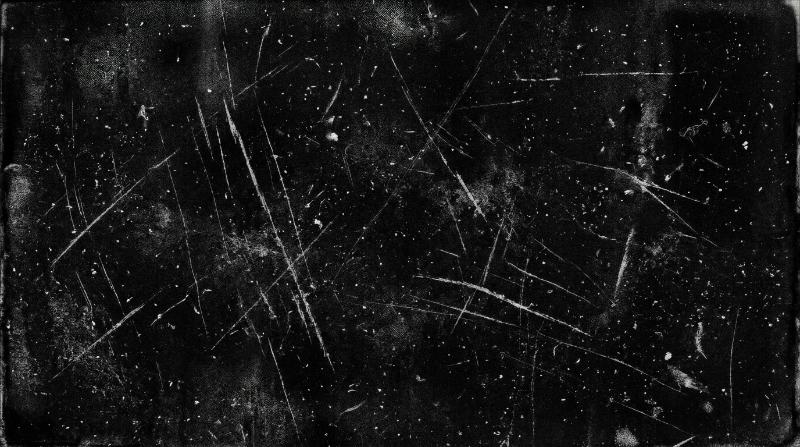 Grunge dust and scratch overlay on a black background, noisy film grain and distressed old-photo texture with worn imperfections, raw vintage darkness, ultra-realistic, no logos.