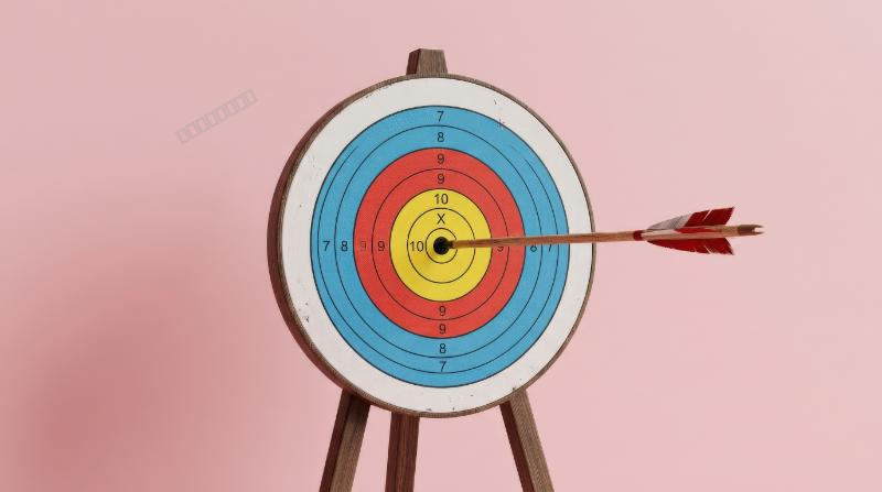 An arrow striking the exact center of a target on a pink pastel background, clean composition, success-focused energy, soft premium lighting, ultra-realistic, no logos.