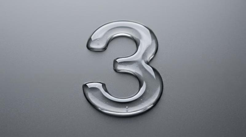 A number three formed from transparent clear liquid on a flat grey background, crisp glossy contours and clean negative space, sleek countdown aesthetic, ultra-realistic, no logos.