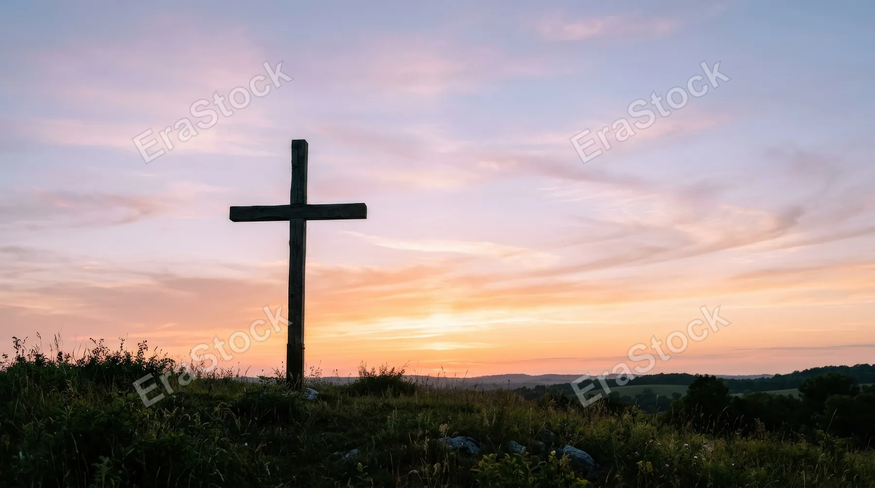 A wooden Christian cross silhouette against a soft pastel sunset sky, minimal composition, tranquil horizon glow and peaceful spiritual atmosphere, ultra-realistic, no logos.