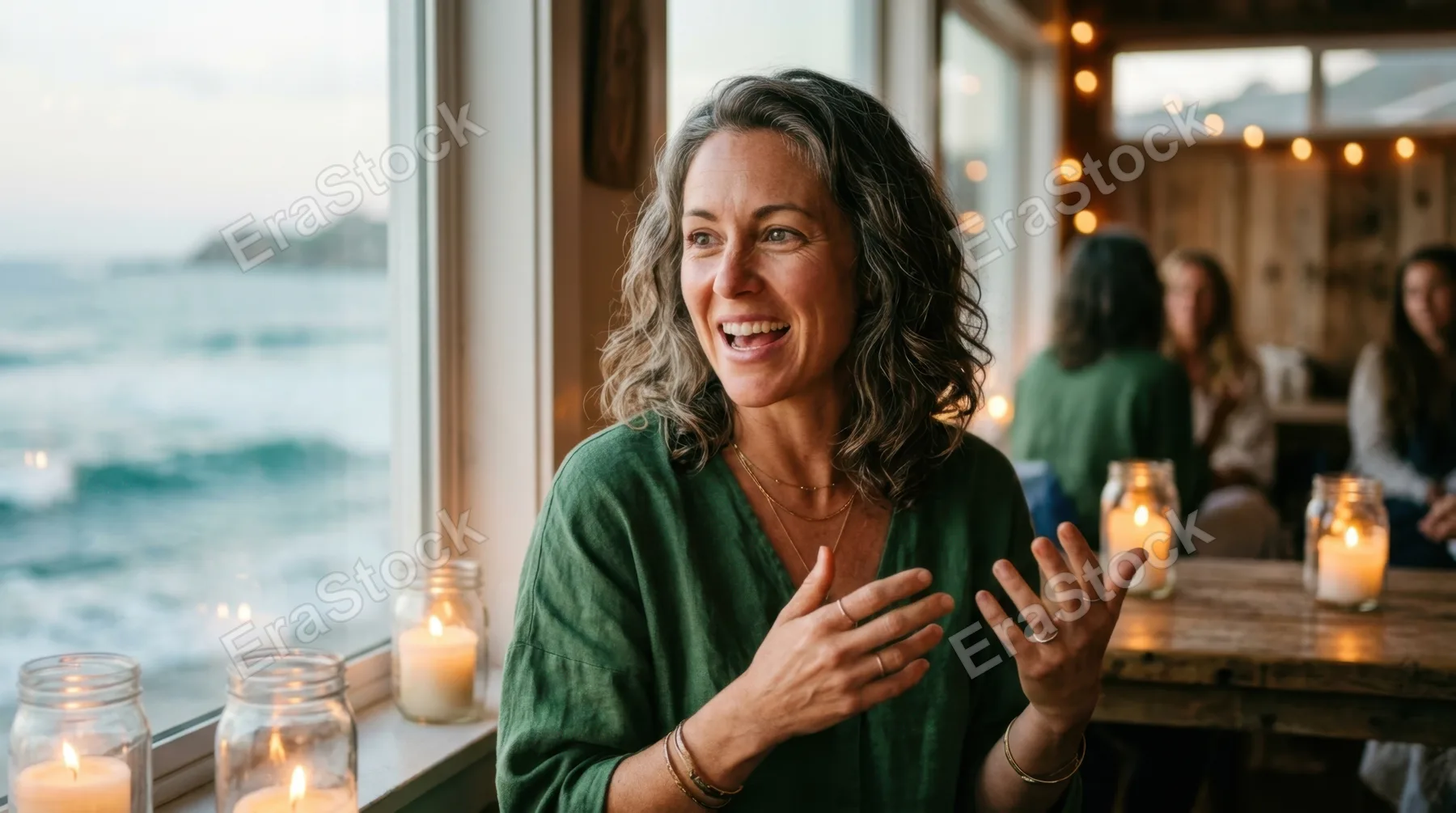 close-up of the wellness advocate as she speaks, her warm expression filled with enthusiasm, with soft candlelight flickering around her, enhancing the intimate
