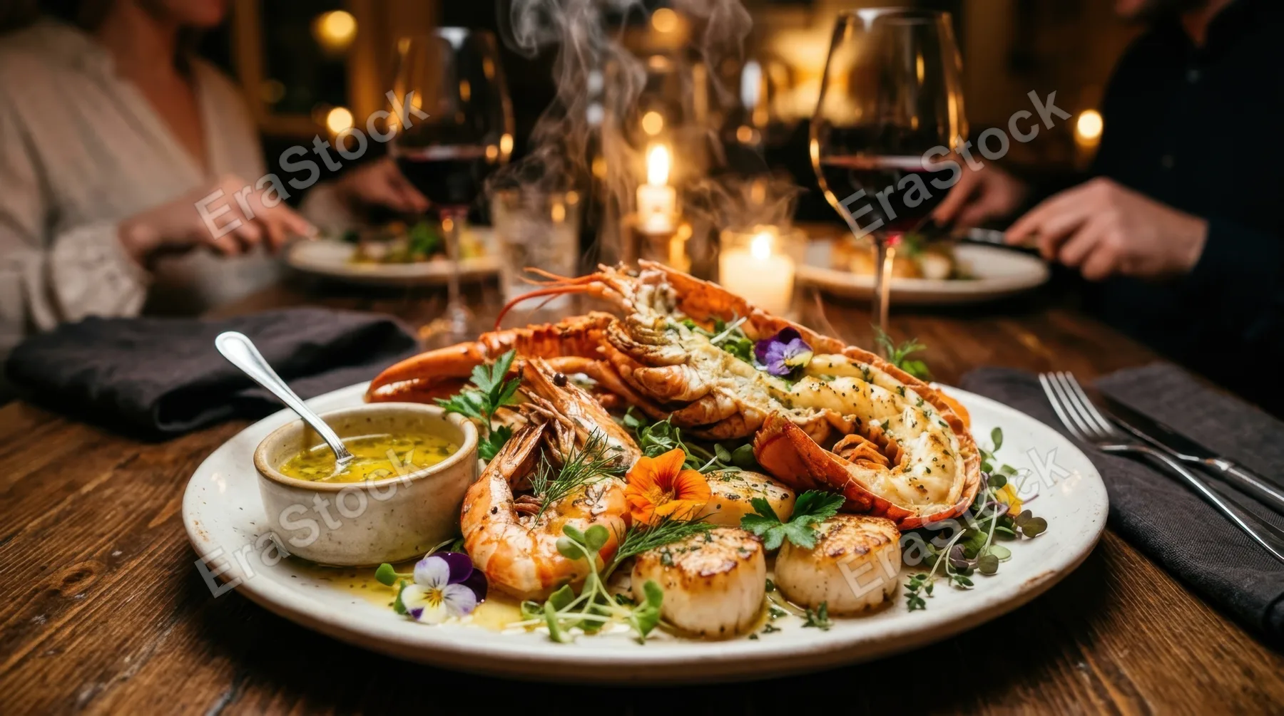 Steaming hot seafood platter with lobster tail, jumbo shrimp, and scallops arranged on white ceramic, melted butter sauce pooling nearby, fresh herbs and edible flowers