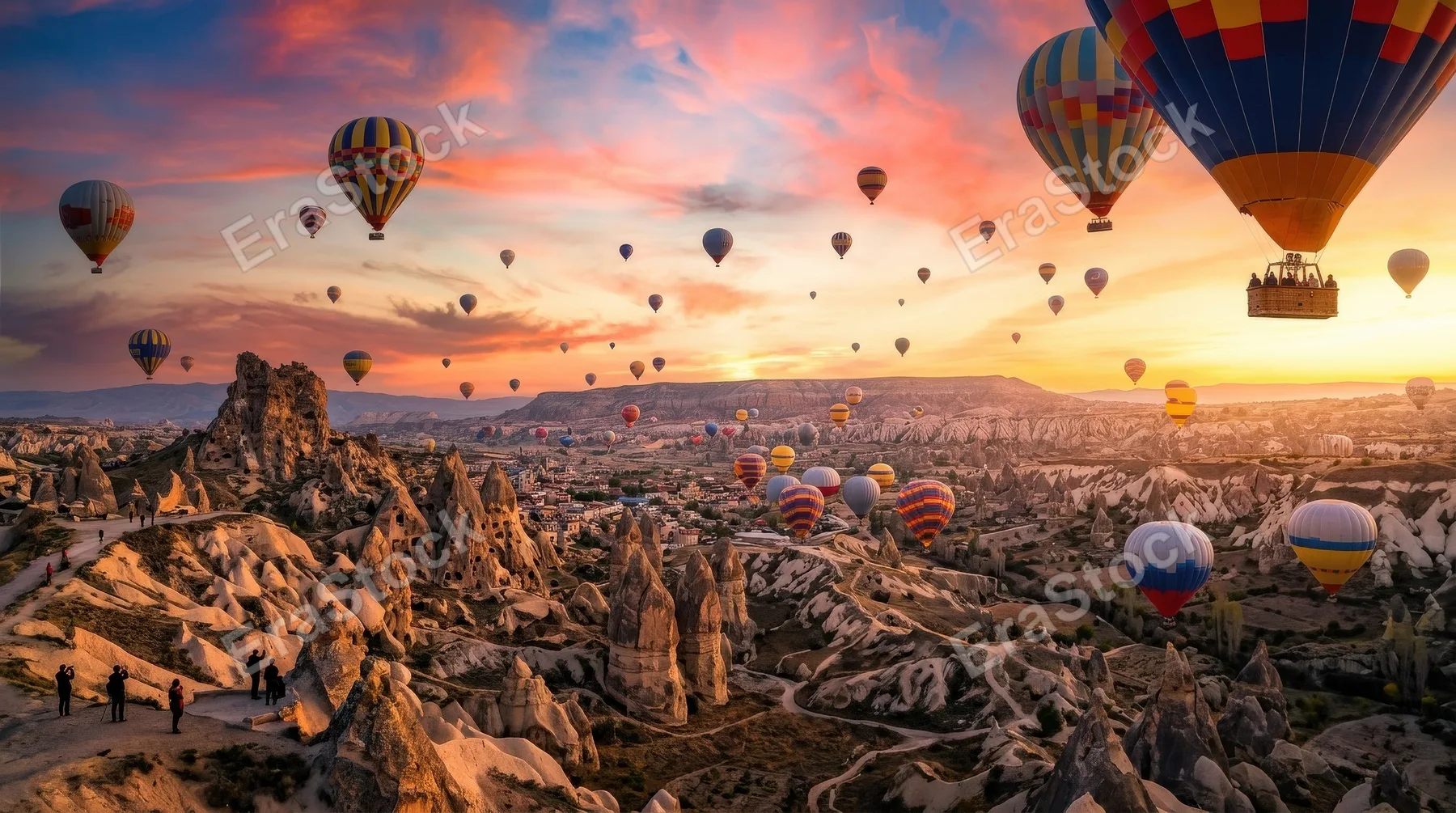Vibrant hot air balloons soaring above the iconic rock formations of Cappadocia, glowing sky, tourism adventure spirit, breathtaking travel atmosphere, ultra-realistic, no logos.