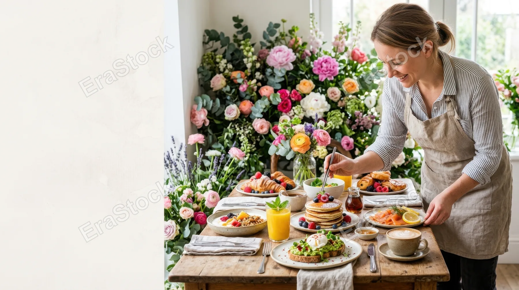 a graphic commercial shot of the food stylist against a backdrop of vibrant flowers, focused on the beautifully arranged brunch spread she serves. the composition is