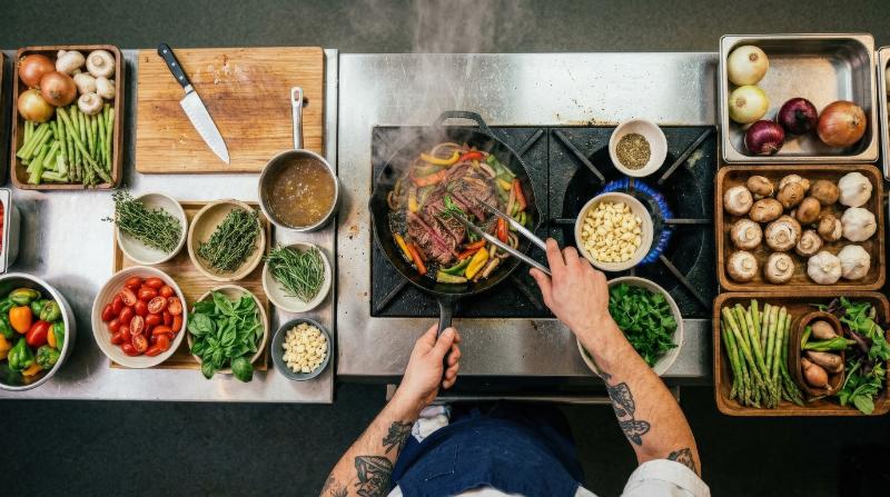 Top view of a chef cooking with fresh ingredients in a kitchen, restaurant menu concept, rich food textures and culinary action, ultra-realistic, no logos.