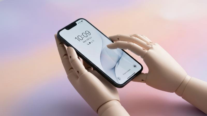 Mannequin hands holding a sleek smartphone on a pastel background, smooth prosthetic-like forms, refined shadows, clean modern tech aesthetic, ultra-realistic, no logos.
