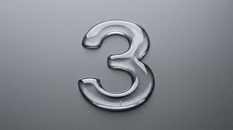 A number three formed from transparent clear liquid on a flat grey background, crisp glossy contours and clean negative space, sleek countdown aesthetic, ultra-realistic, no logos.
