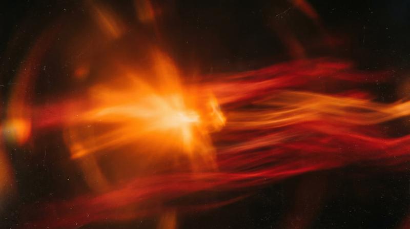 Abstract orange light flare on transparency, red-toned motion blur and soft retro lens haze creating warm energy, ultra-realistic, no logos.