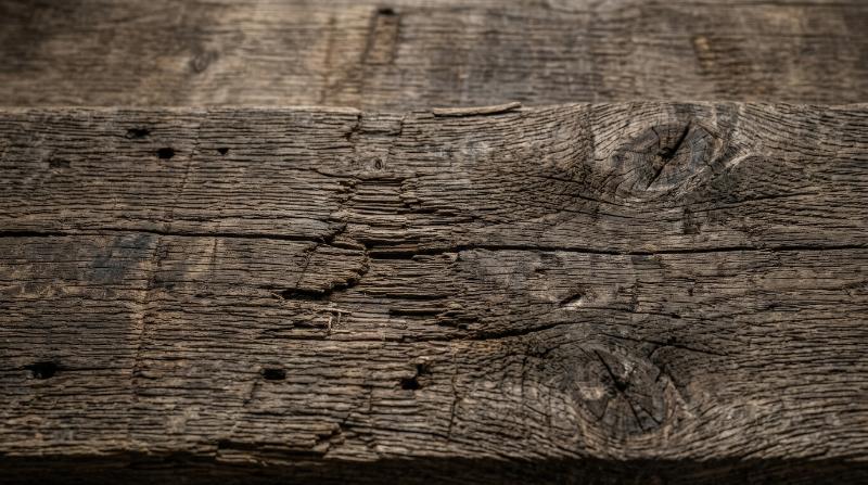 Old wood texture with aged grain and worn patina, rustic tactile detail, timeless natural atmosphere, ultra-realistic, no logos.