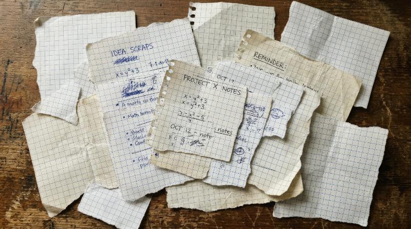 A torn paper sheet set of square-grid notebook scraps with rough ripped edges, layered stationery texture, realistic collage look, ultra-realistic, no logos.