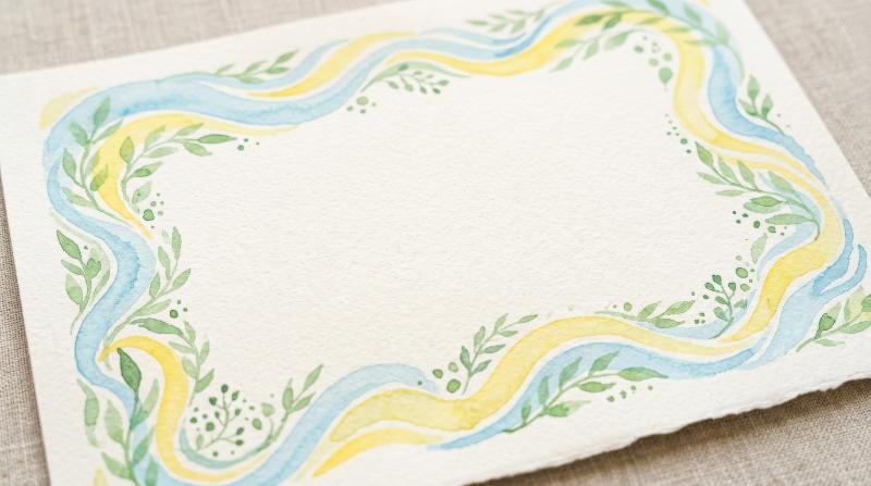 Whimsical watercolor background frames with light blue and yellow wave stripes and green accents, airy pastel borders and hand-painted softness, cheerful refined mood for festive paper goods,