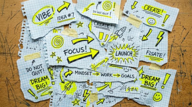 Crumpled torn graph-paper pieces with yellow doodle highlights and arrows, layered collage scraps and a bright youthful retro mood, ultra-realistic, no logos.