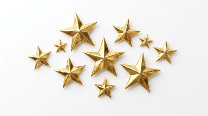 A set of gold stars isolated on white, polished metallic shine, crisp edges, elegant celebratory simplicity, ultra-realistic, no logos.
